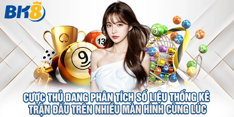 Cược thủ đang phân tích số liệu thống kê trận đấu trên nhiều màn hình cùng lúc